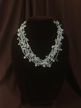 Load image into Gallery viewer, Multi-strand necklace of pale blue glass beads with block tabs; treasure-style;
