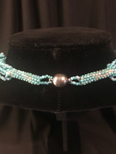 Load image into Gallery viewer, Multi-strand necklace of pale blue glass beads with block tabs; treasure-style;
