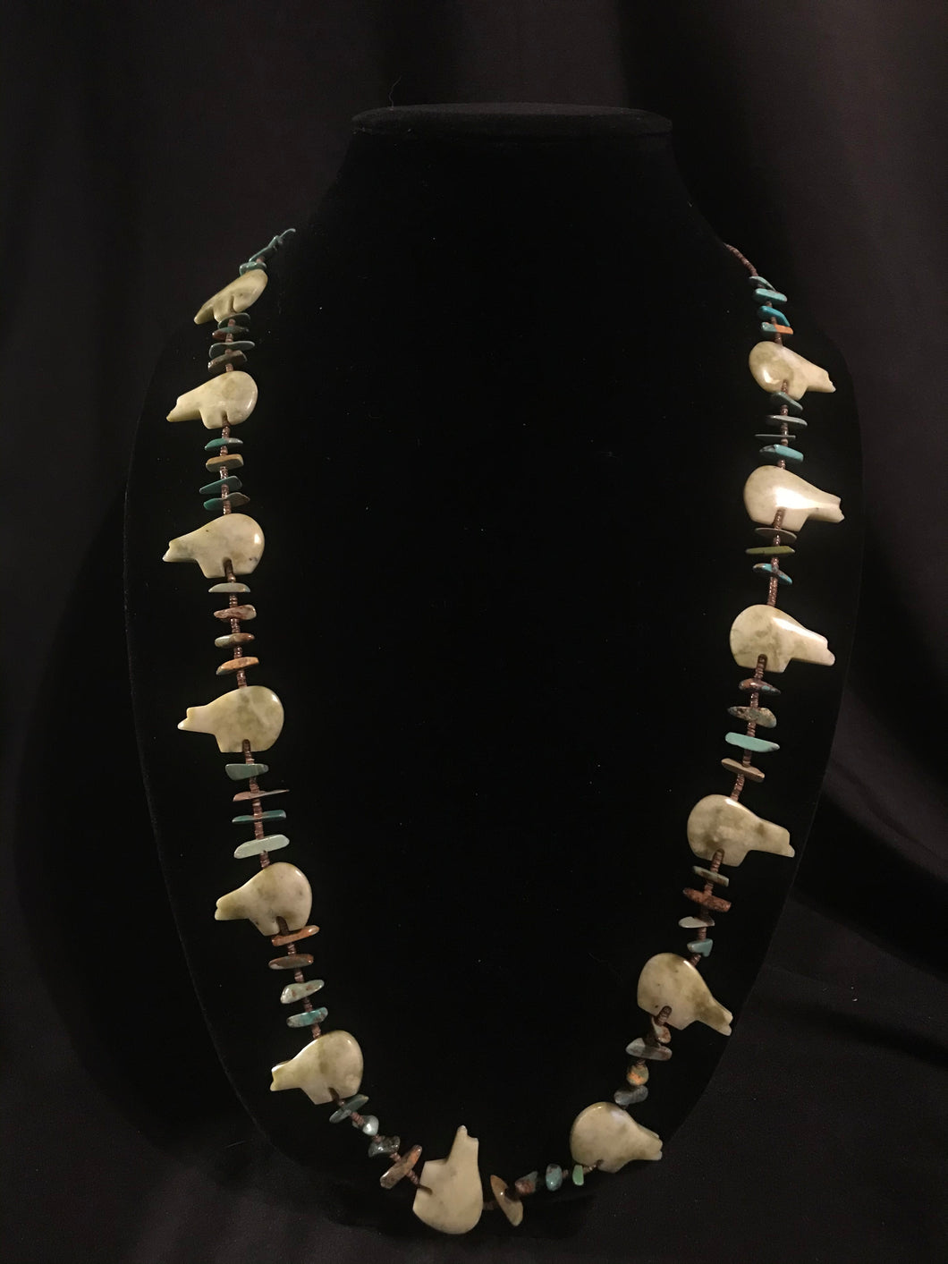 Zuni single strand necklace with dark heishi beads and fetish bears.