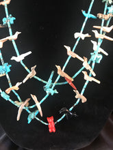 Load image into Gallery viewer, Zuni 3 strand rolled turquoise bead necklace with carved fetishes.
