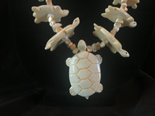 Load image into Gallery viewer, Single strand mother-of-pearl turtle carving necklace.

