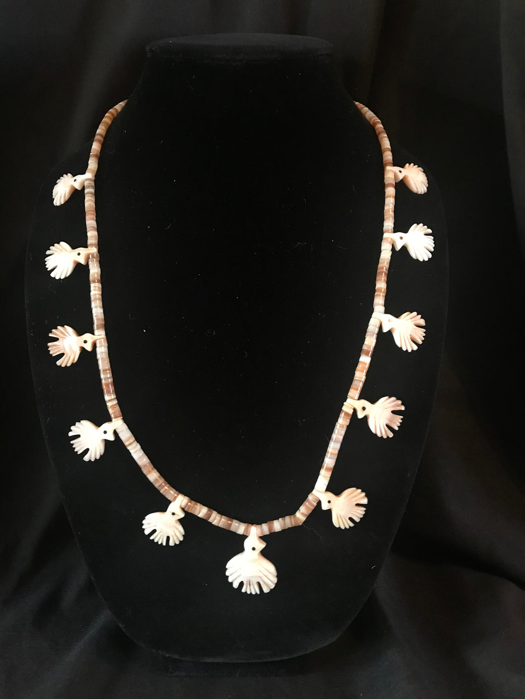 Single strand necklace of imported heishi beads & birds