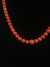 Load image into Gallery viewer, Single strand of graduated round coral beads with matching earrings
