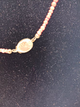 Load image into Gallery viewer, Single strand of graduated round coral beads with matching earrings
