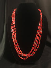 Load image into Gallery viewer, Four strand necklace of olive heishi beads interspersed with dyed red coral tube beads.
