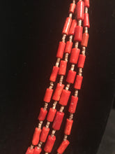 Load image into Gallery viewer, Four strand necklace of olive heishi beads interspersed with dyed red coral tube beads.
