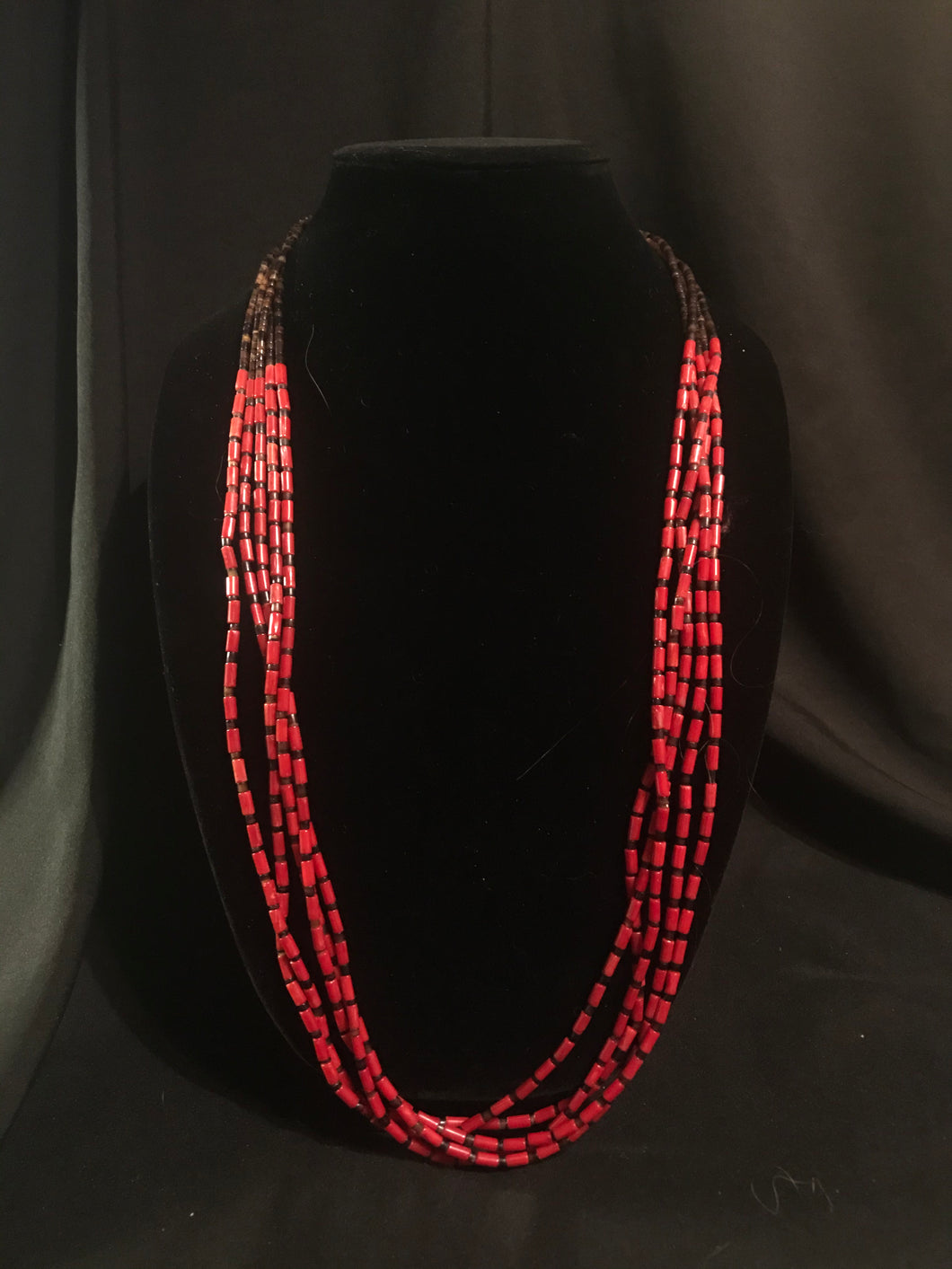 Five strands of red dyed coral tube beads; Santa Domingo Pueblo