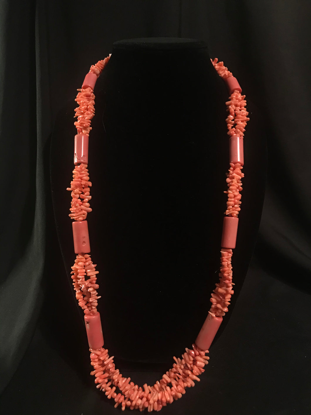 Single strand of large dyed Asian coral cylinder beads