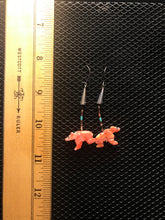 Load image into Gallery viewer, Silver colored hook earrings with coral colored bear fetish from spiny oyster.
