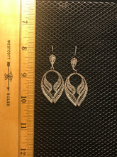 Load image into Gallery viewer, Silver colored filigree angel wings on hook earrings.
