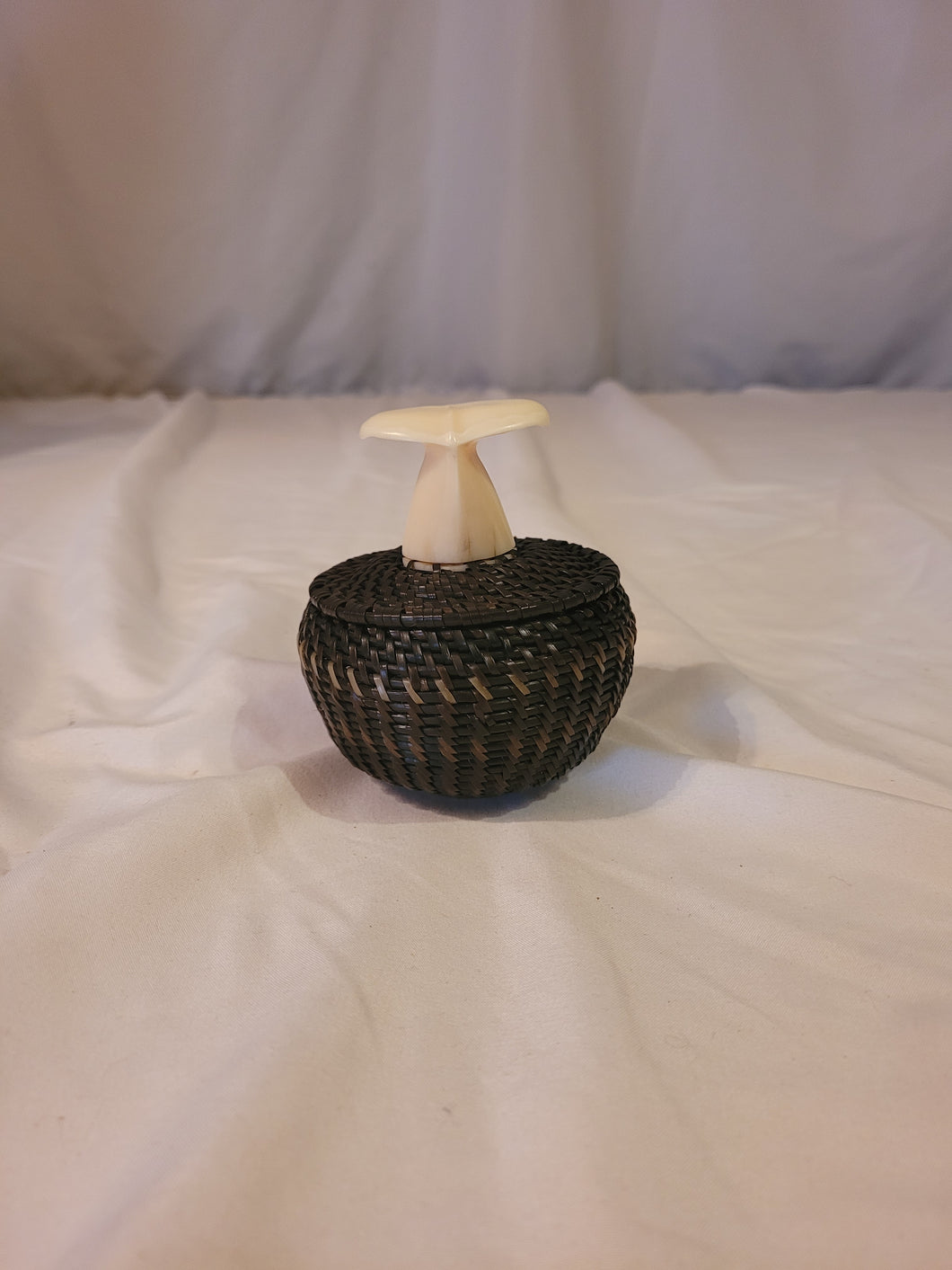 Baleen woven basket with walrus ivory whale tale by Alaskan Inuit basket weaver James Omnik Jr.