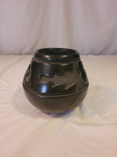 Load image into Gallery viewer, Black Pot with carved Awanyu (water serpent)Tewa deity by Stella Chavarria (1939 - 1999)

