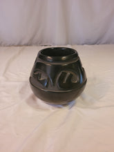 Load image into Gallery viewer, Black Pot with carved Awanyu (water serpent)Tewa deity by Stella Chavarria (1939 - 1999)
