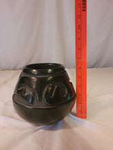 Load image into Gallery viewer, Black Pot with carved Awanyu (water serpent)Tewa deity by Stella Chavarria (1939 - 1999)
