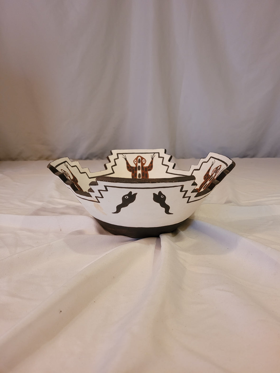 Zuni brown frogs and black tadpoles on white terrace bowl by Quanita Kalestewa b. 1932