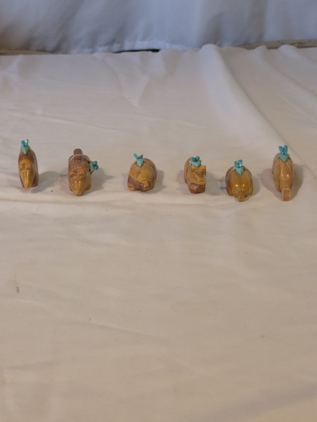 Set of 6 Zuni fetish animals carved from stone. Signed.